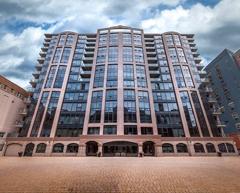 a large building with a blue sky in the background