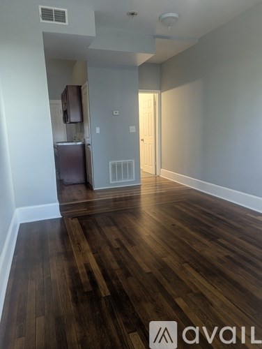 A kitchen with wooden cabinets and a stainless steel oven.