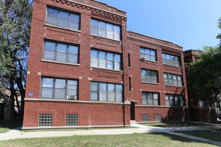 A red brick building with white trim and windows.
