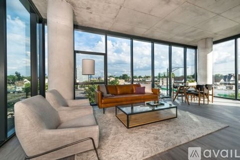 A living room with a couch, chair, and a coffee table.