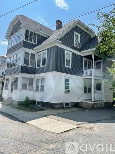 A two-story house with a white front porch.