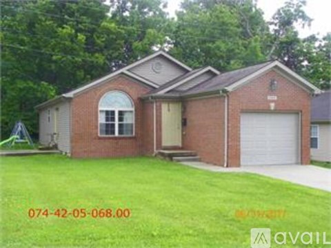 A house with a garage is for sale.