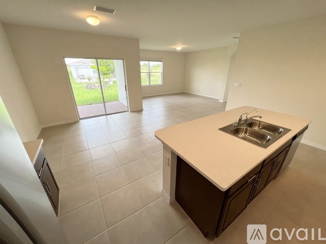 A kitchen area with a sink and a countertop.