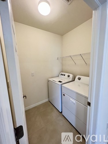 A laundry room with a washer and dryer.