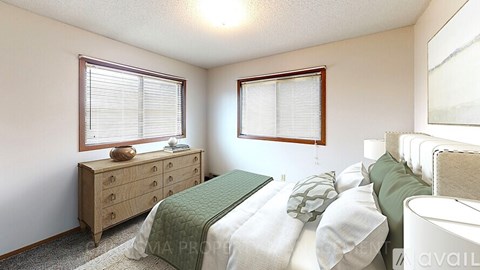 A bedroom with two beds and a dresser.