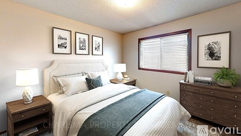A bedroom with a large bed, two nightstands, and a window with blinds.