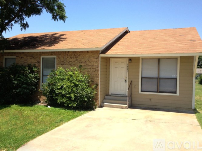 A house with a brown roof and a white door.