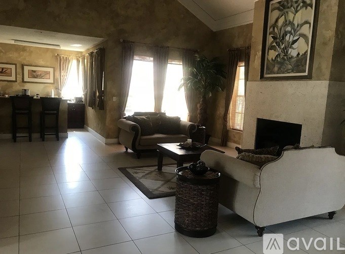 A living room with a fireplace and a couch.