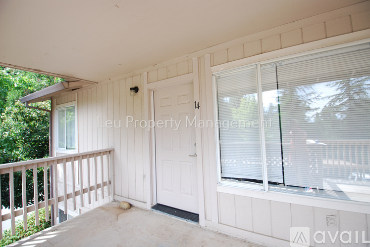 A balcony with a door numbered 14.