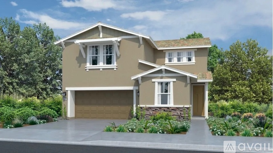 A two-story house with a garage is available for purchase.