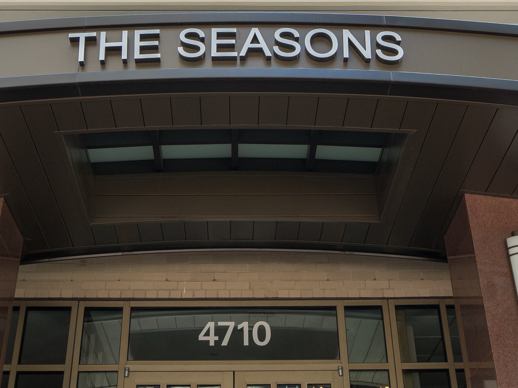 a building with the seasons on top of it