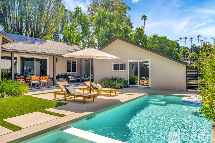 A house with a pool in the backyard.