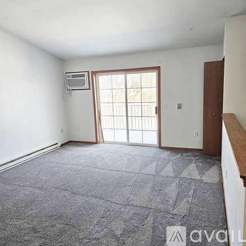 A kitchen with a granite countertop and stainless steel appliances.
