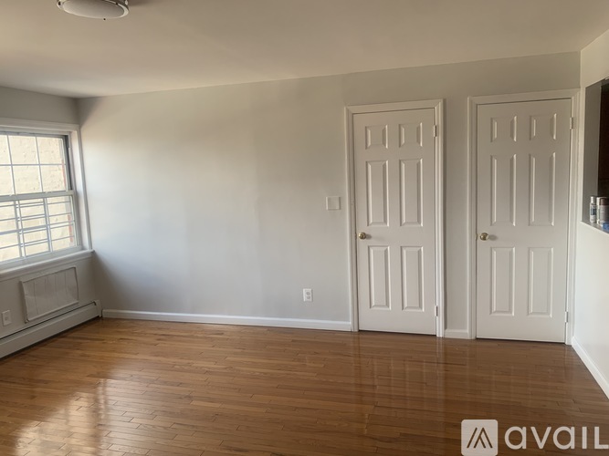 A room with two doors and a window.