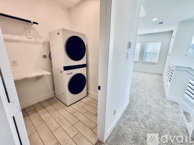 A white washer and dryer in a laundry room.