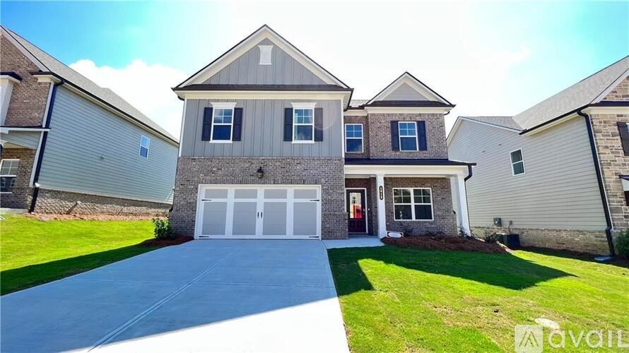 A house with a garage is for sale.