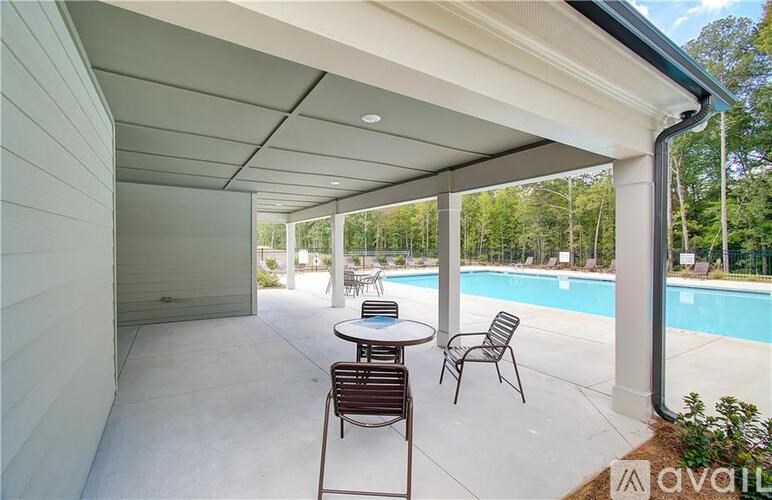 A patio with a table and chairs is shown.