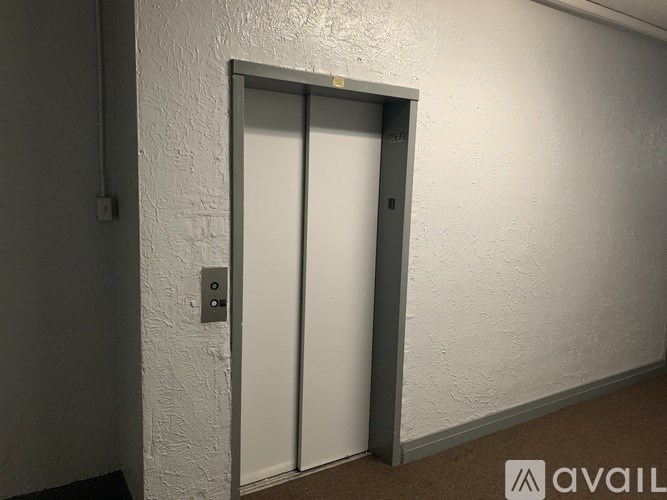 A white door with a grey frame is closed.