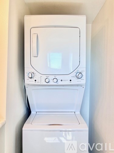 A white washing machine with a digital display and control panel.
