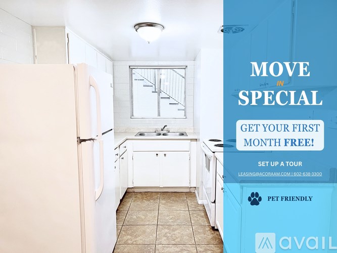 A kitchen with a refrigerator, sink, and cabinets is on sale for the first month free.