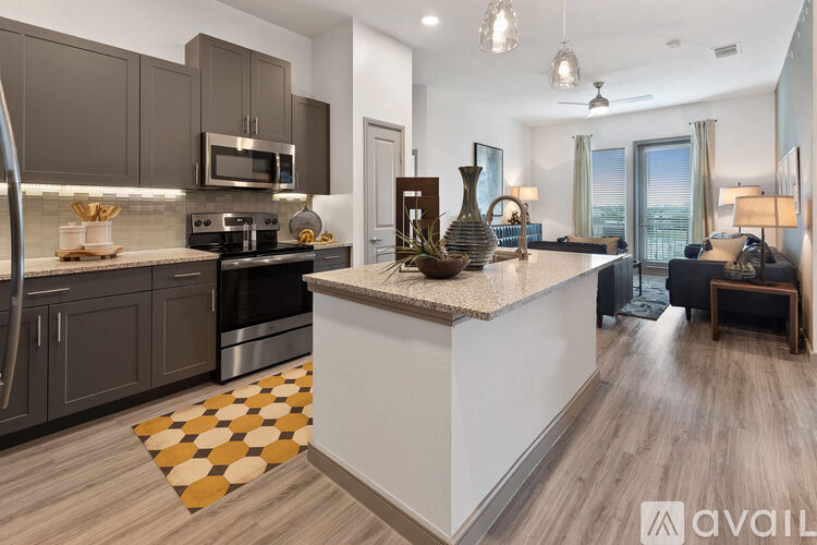 A modern kitchen with a large island in the middle.