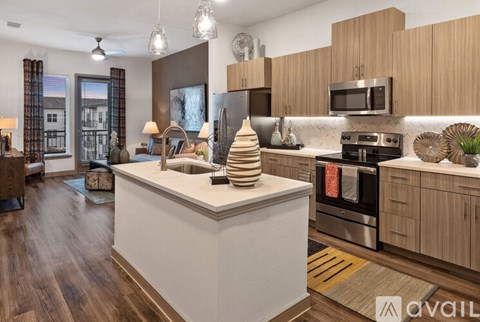 A modern kitchen with wooden cabinets and a large island.
