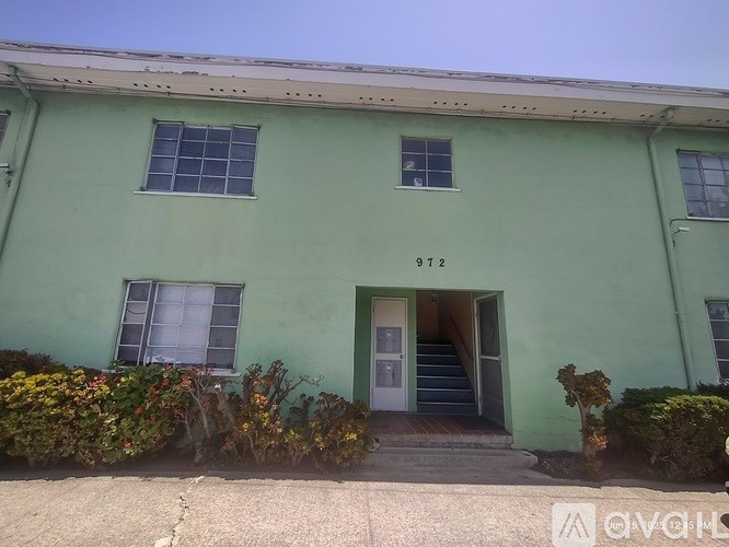 A green building with the number 912 on it.