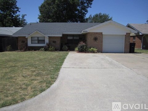A house with a driveway in front of it.