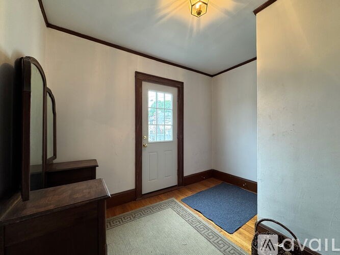 A room with a door and a window.