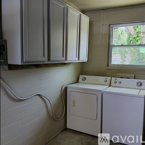 A laundry room with a washer and dryer.