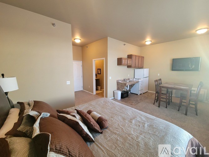 A living room with a couch and a television.