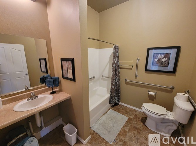 A bathroom with a toilet, sink, and bathtub.