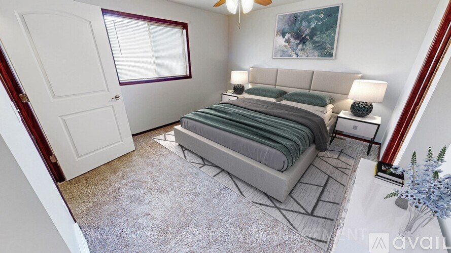 A bedroom with a bed, nightstand, and a painting on the wall.