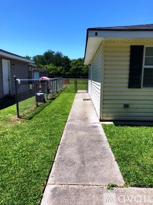 A walkway leads between two houses.