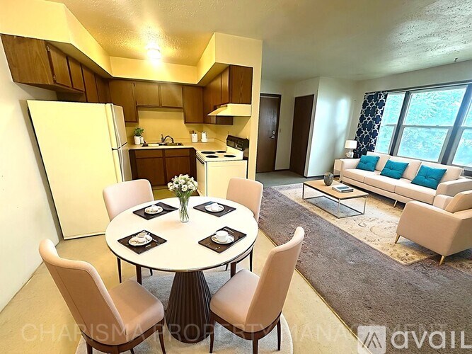 A modern kitchen with a dining table set for four.