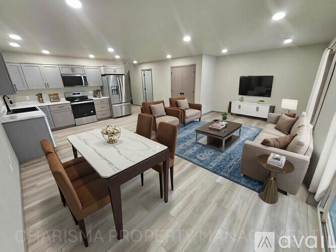 A modern living room with a dining table and chairs.