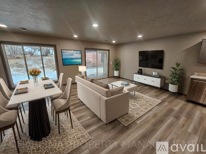 A modern living room with a dining table and a couch.