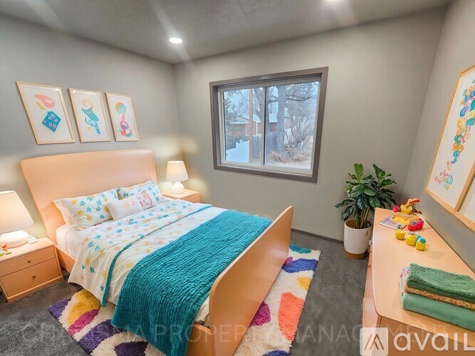 A bedroom with a bed, a nightstand, a window, a rug, a plant, and pictures on the wall.