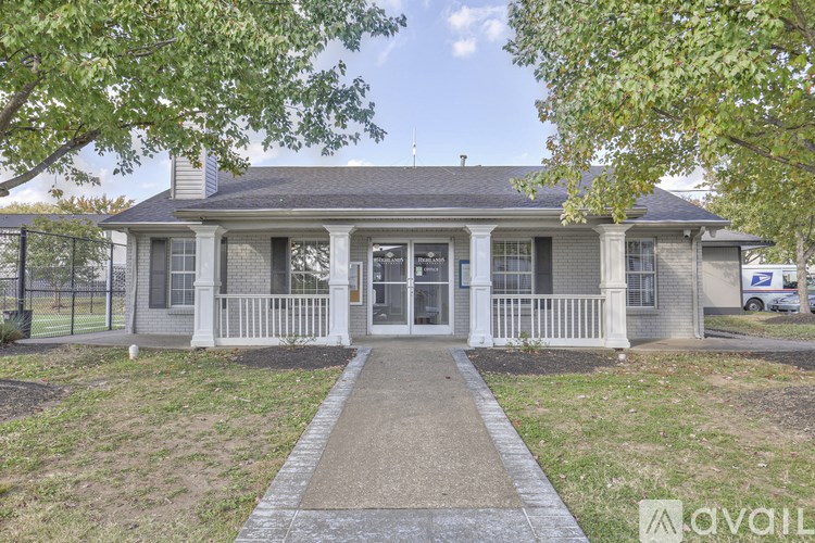 A house with a front porch and a mailbox on the right side.