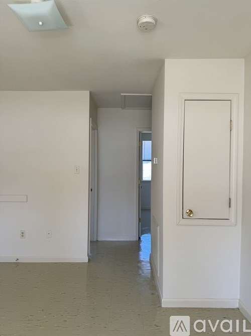 A room with a door and a window.