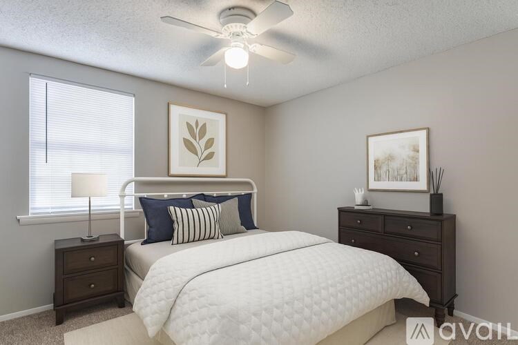 A 3D image of a house layout with a kitchen, living room, and two bedrooms.