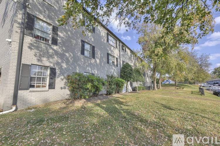 A building with a grassy area in front of it.