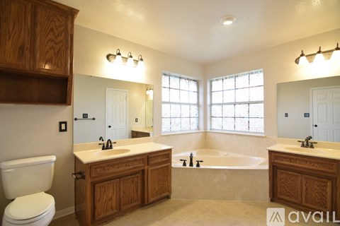 A room with a ceiling fan and a window.