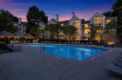 A large house with a pool in the backyard.