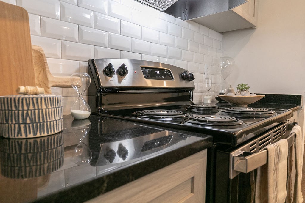 a kitchen with a stove and a sink