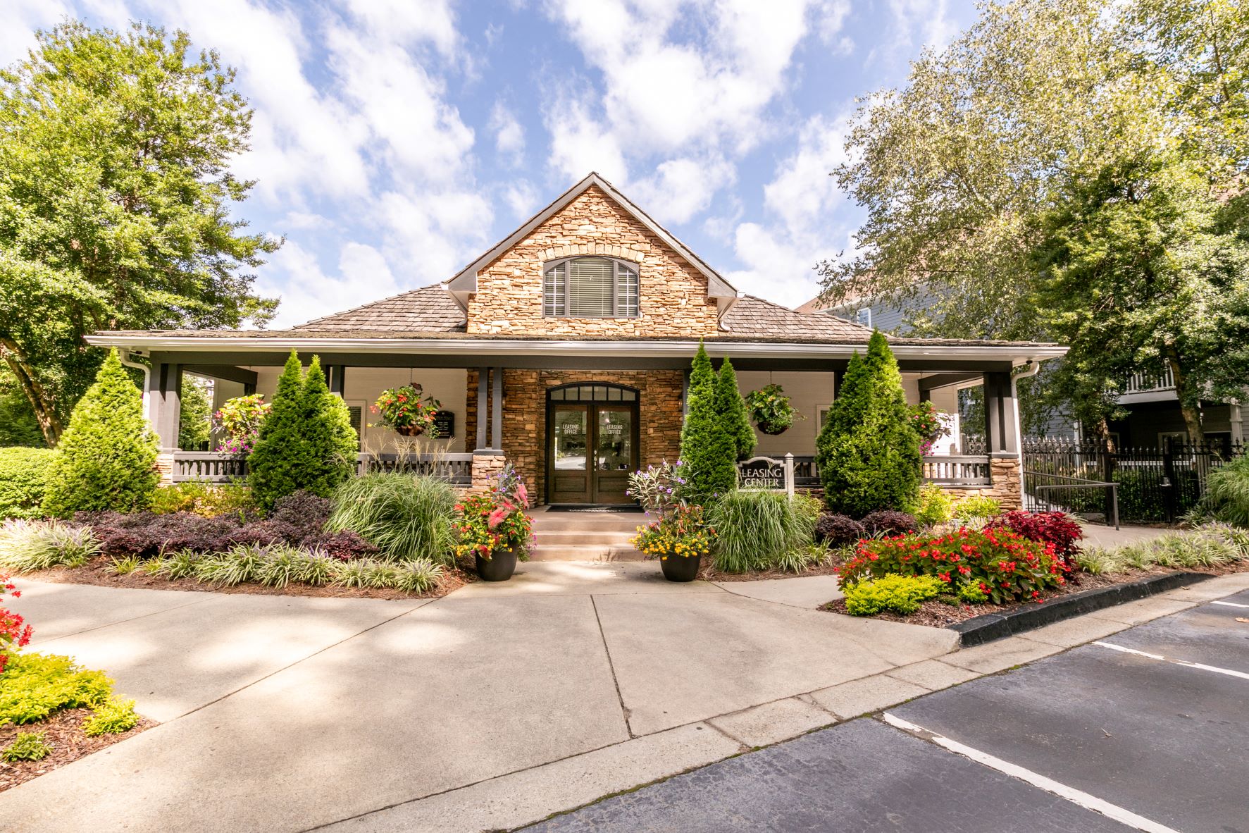 the front of a house with a driveway and landscaping