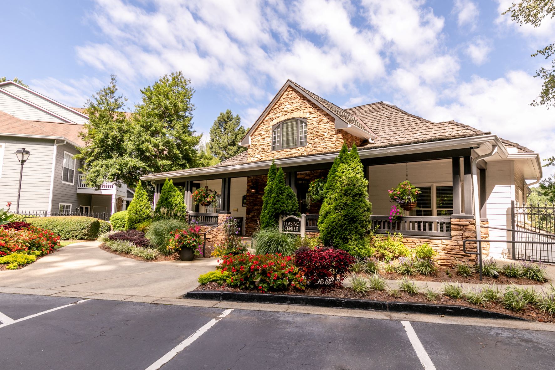 a house with a porch and a street in front of it