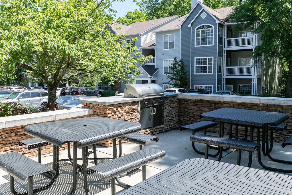 our apartments have a patio with tables and chairs