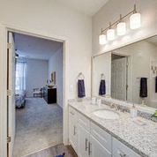 a bathroom with a sink and a large mirror
