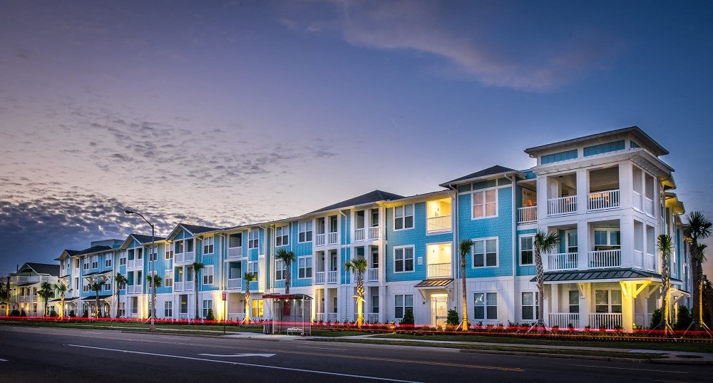 a row of colorful apartment buildings on a city street